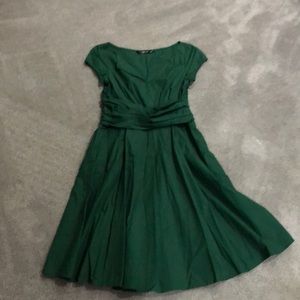 Gorgeous green dress with pleated skirt and pockets
